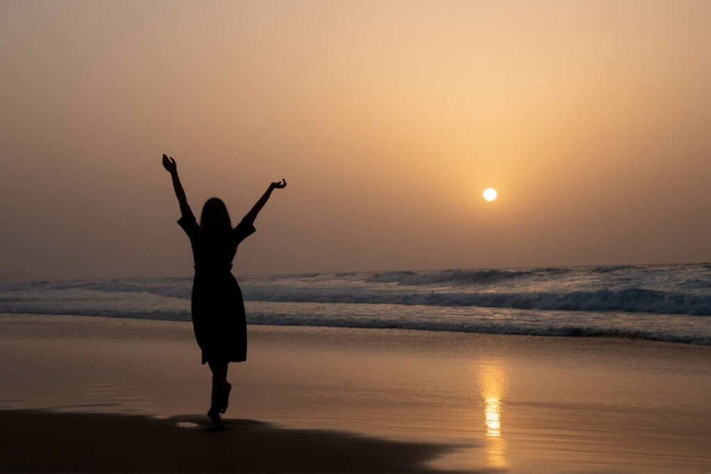 woman silhouette on beach